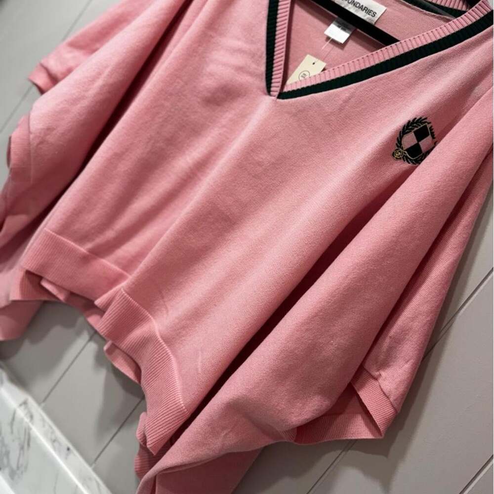 Pink oversized pancho/sweater with black trim